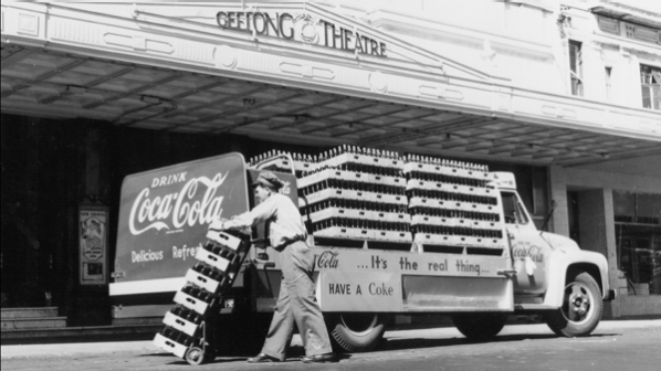 Coca-Cola delivery truck in front of a movie theatre in Australia, Coca-Cola delivery truck in front of a movie theatre in Australi