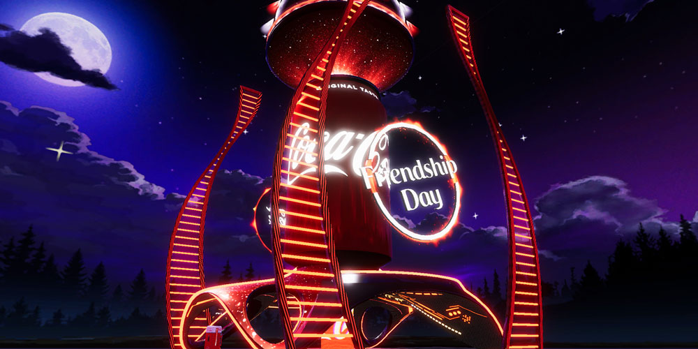 Lit up Coca-Cola can & NFT Friendship Day sign set against a dark forest & night skies
