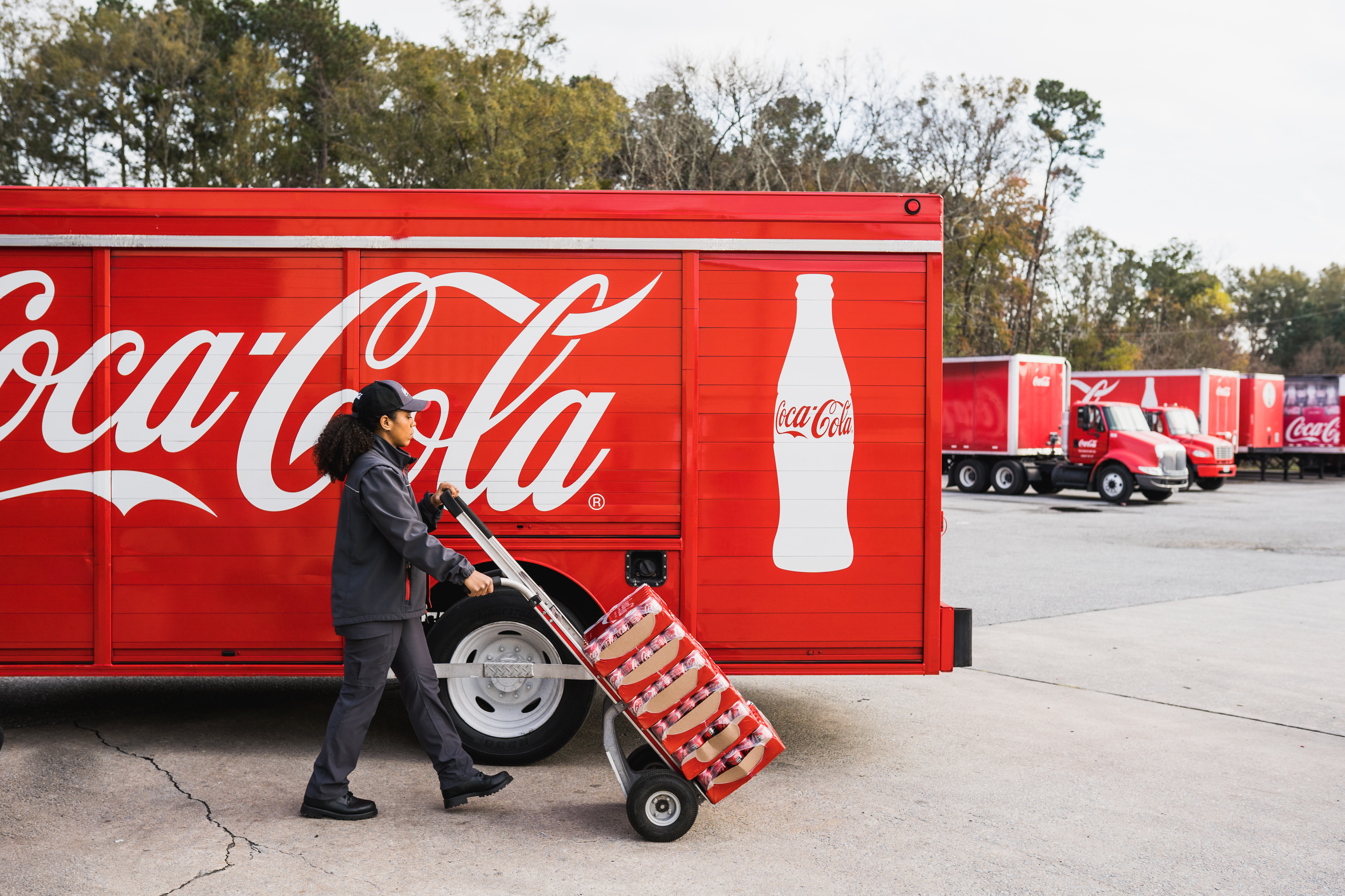 Coca Cola Truck Driver Delivering Bottles