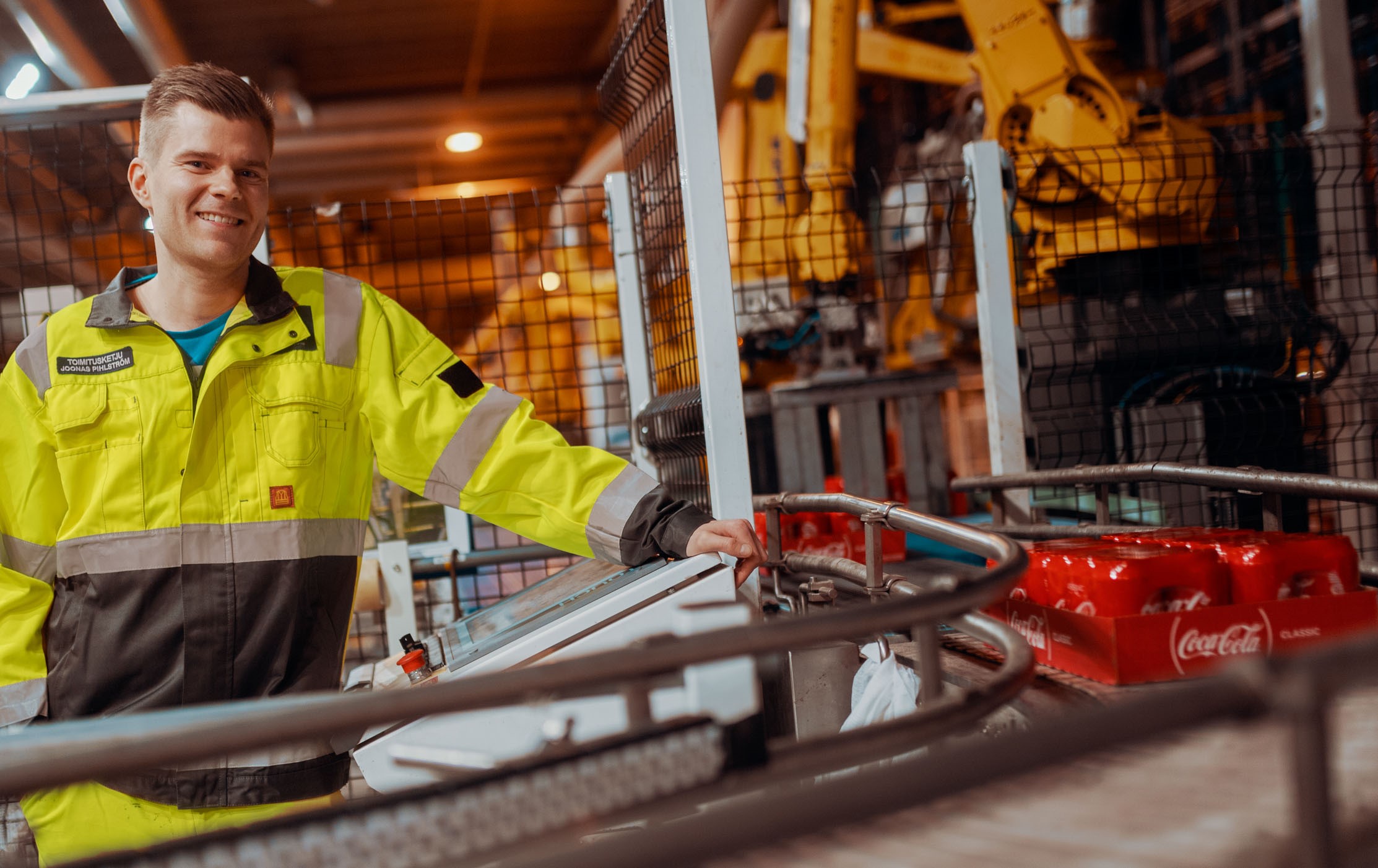 A man operating a bottler service line