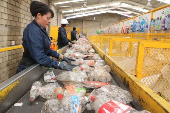 Workers separate PET plastics for recycling at the PetStar facility outside of Mexico City