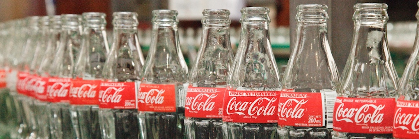 Coca-Cola glass bottles in a production line 