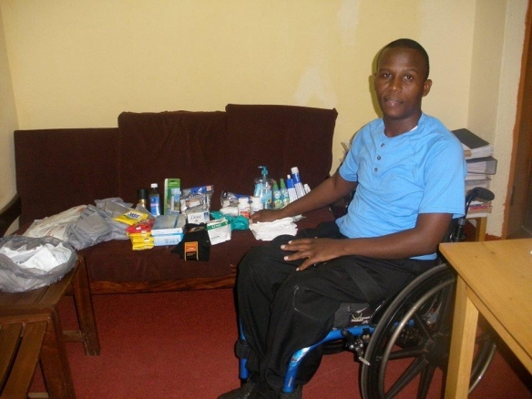 Father Thomas receives a shipment of medical supplies at his home in Uganda.