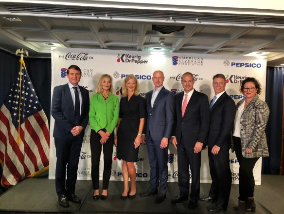 From left: Kirk Tanner, CEO, PepsiCo Beverages North America; Sheila Bonini, SVP, private sector engagement, WWF; Katherine Lugar, president and CEO, ABA; Derek Hopkins, chief commercial officer, Keurig Dr Pepper; Jim Dinkins, president, Coca-Cola North America; Ron Gonen, CEO, Closed Loop Partners; and Keefe Harrison, CEO, The Recycling Partnership, at the "Every Bottle Back" press conference in Washington, D.C.