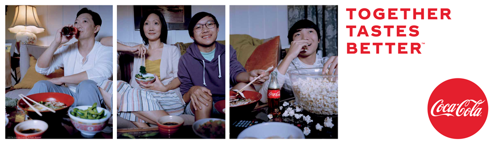 Friends sitting on a couch drinking Coca-Cola 