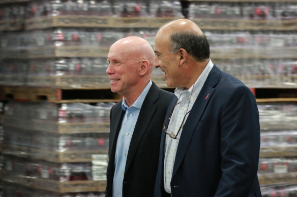 Muhtar Kent, chairman of The Coca-Cola Company, and Frank Harrison tour the new Louisville facility.