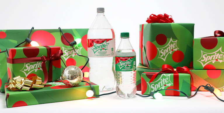 Sprite Holiday flavors surrounded by gifts wrapped in custom Sprite gift wrap paper