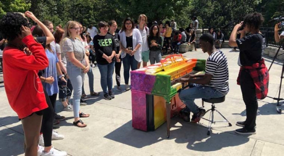 A crowd gathers to watch an impromptu performance in Atlanta's Piedmont Park.