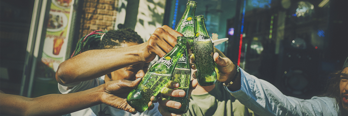Young men enjoying Sprite As The Coca-Cola Company continues to increase its presence and is seeking innovation and growth.