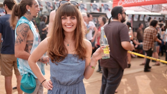 Girl enjoys Topo Chico