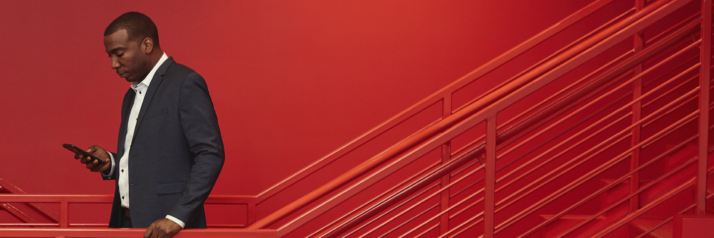 Terrell Massey standing in red staircase