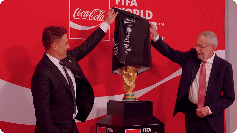 Two men unveiling the original FIFA World Cup Trophy