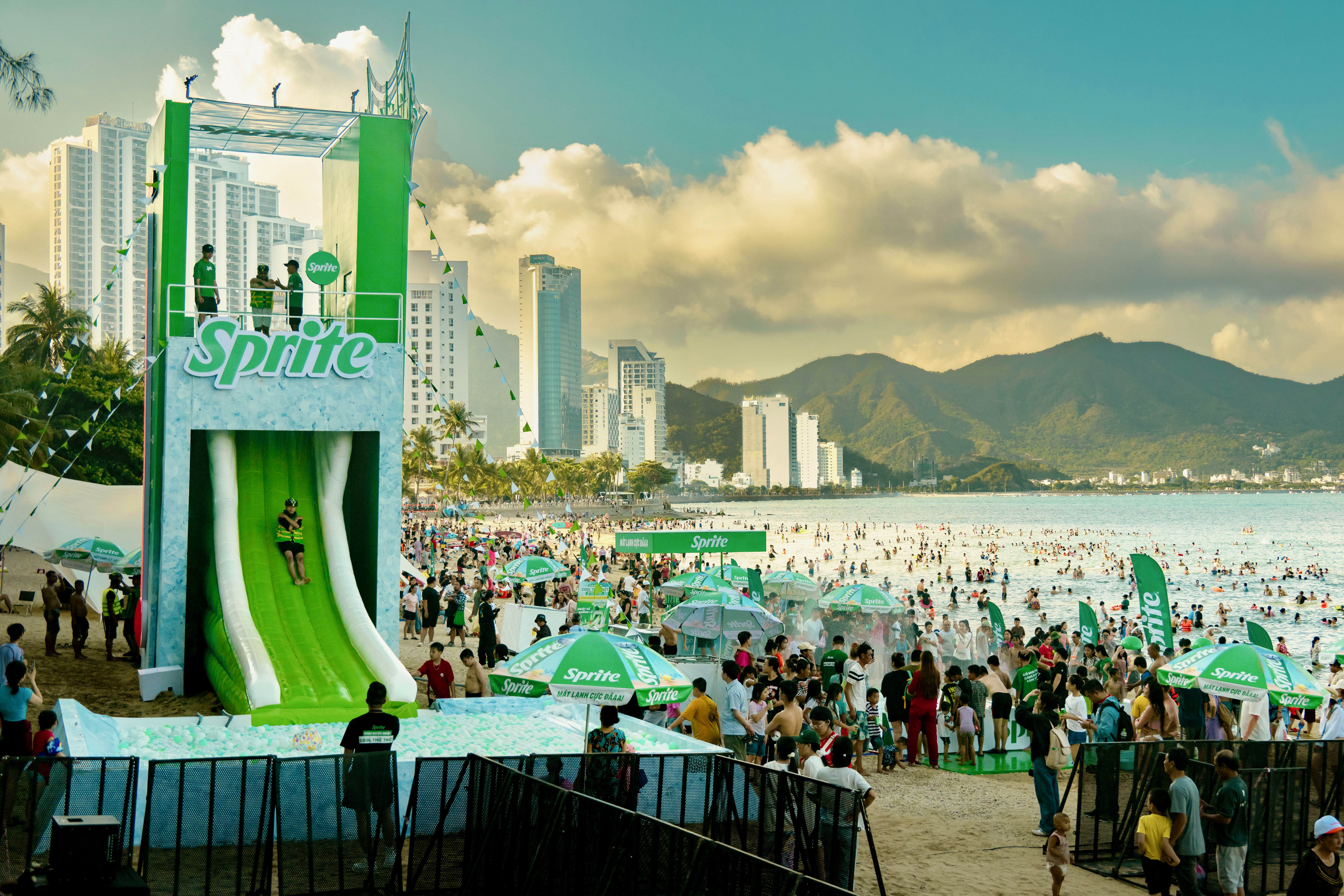 Sprite branded inflatable slide on a crowded beach