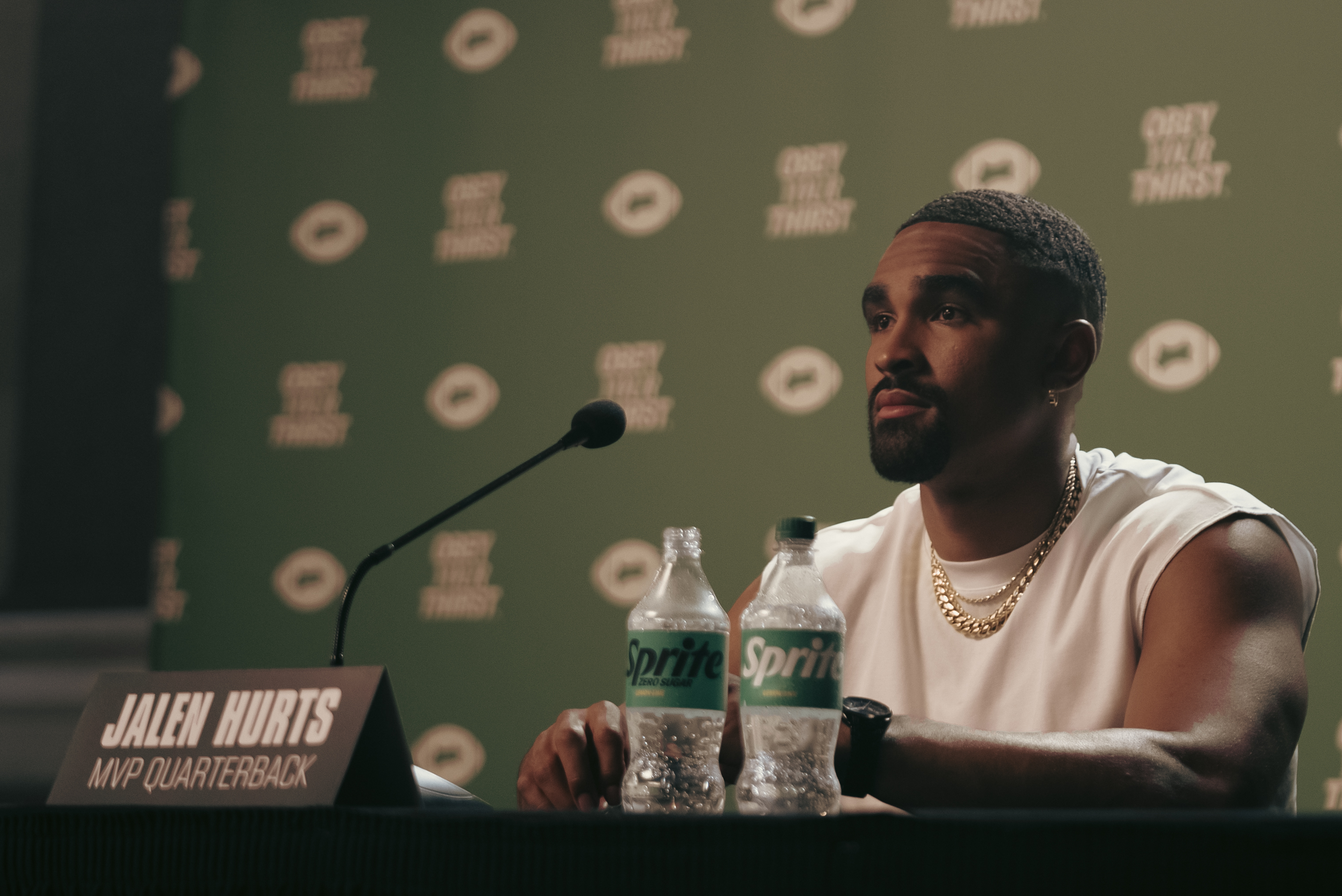 Jalen Hurts sits in front of a Sprite media backdrop ready to take questions