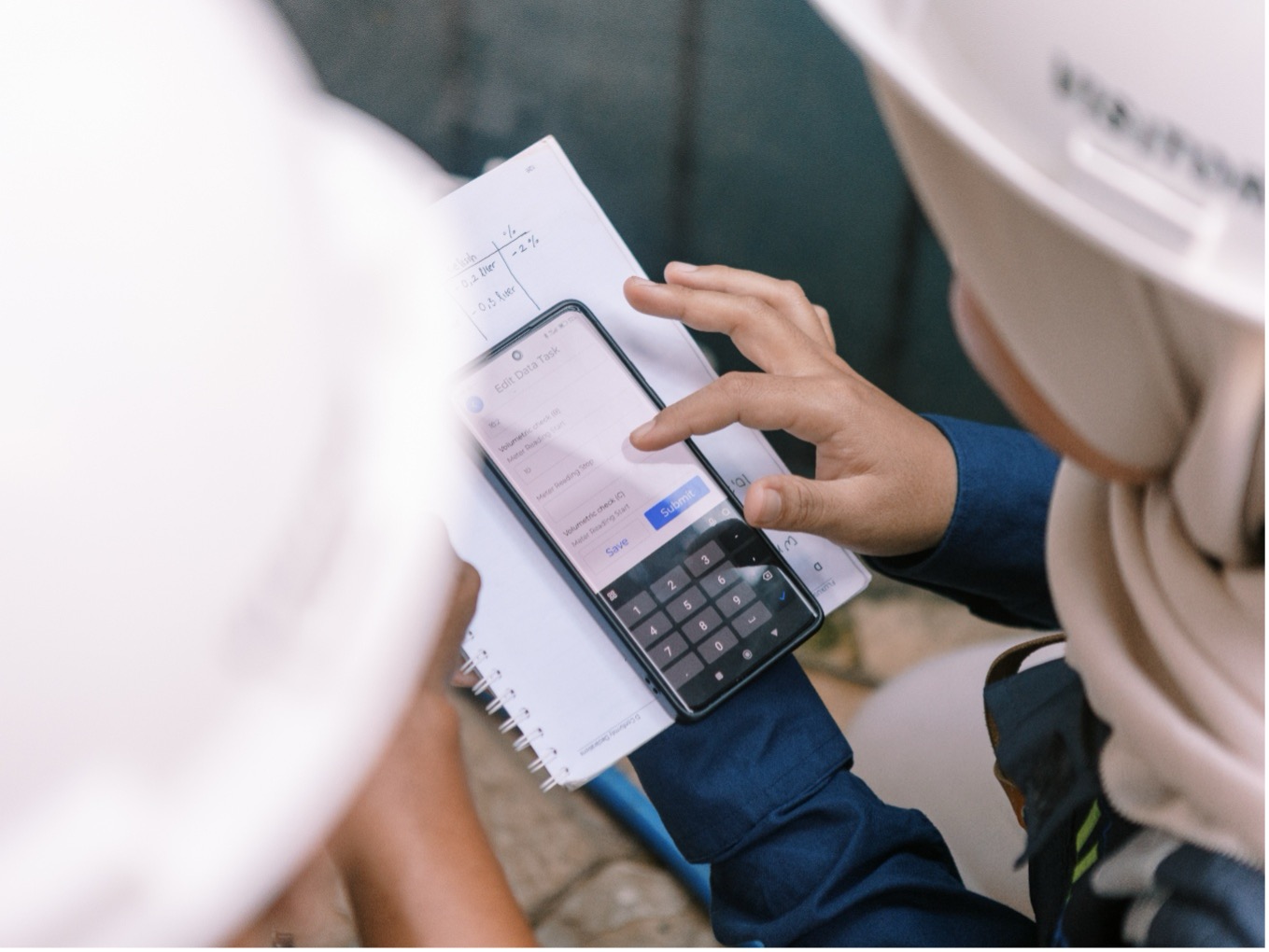 2 people checking a phone.