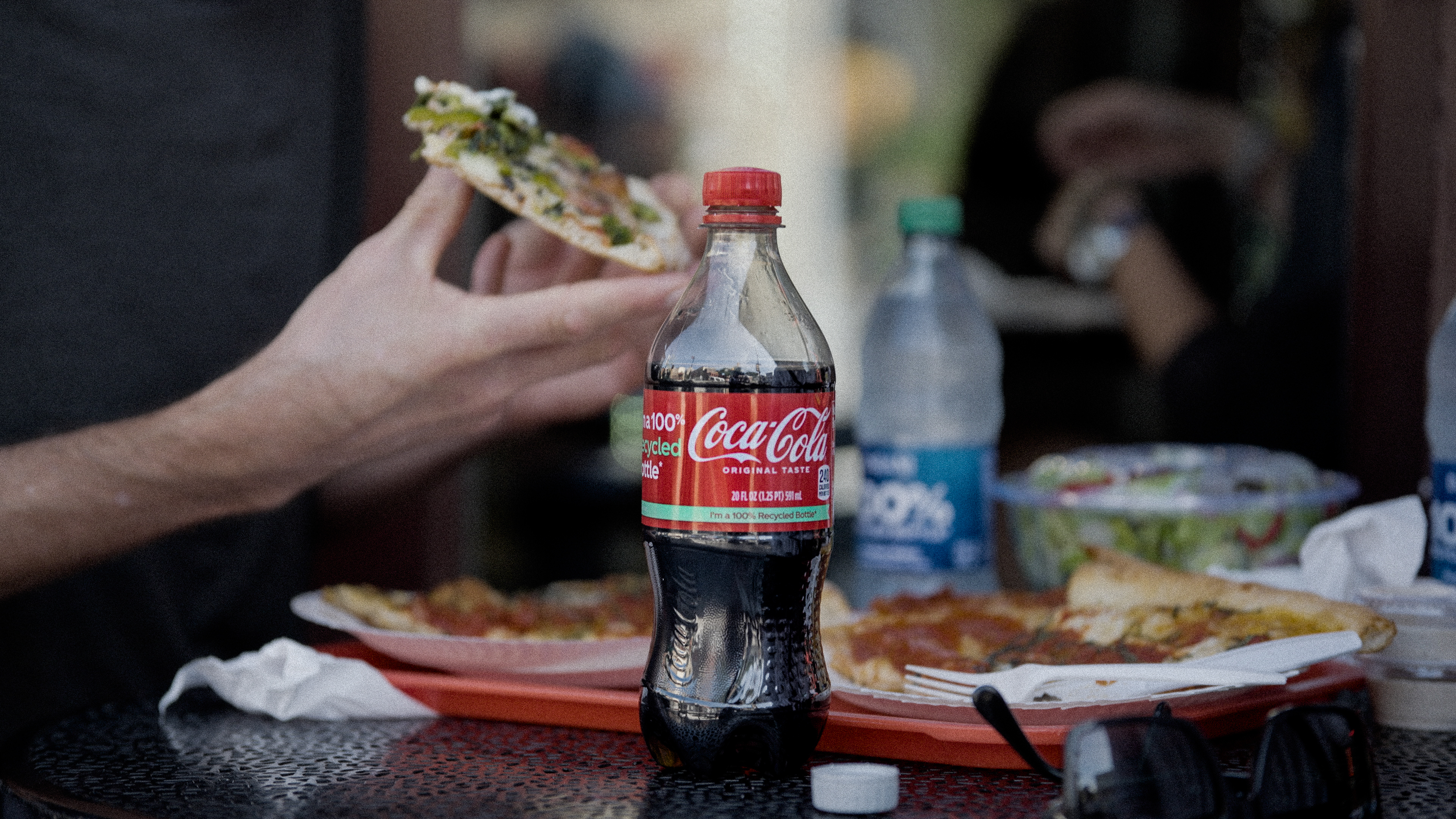 lady with pizza and coke