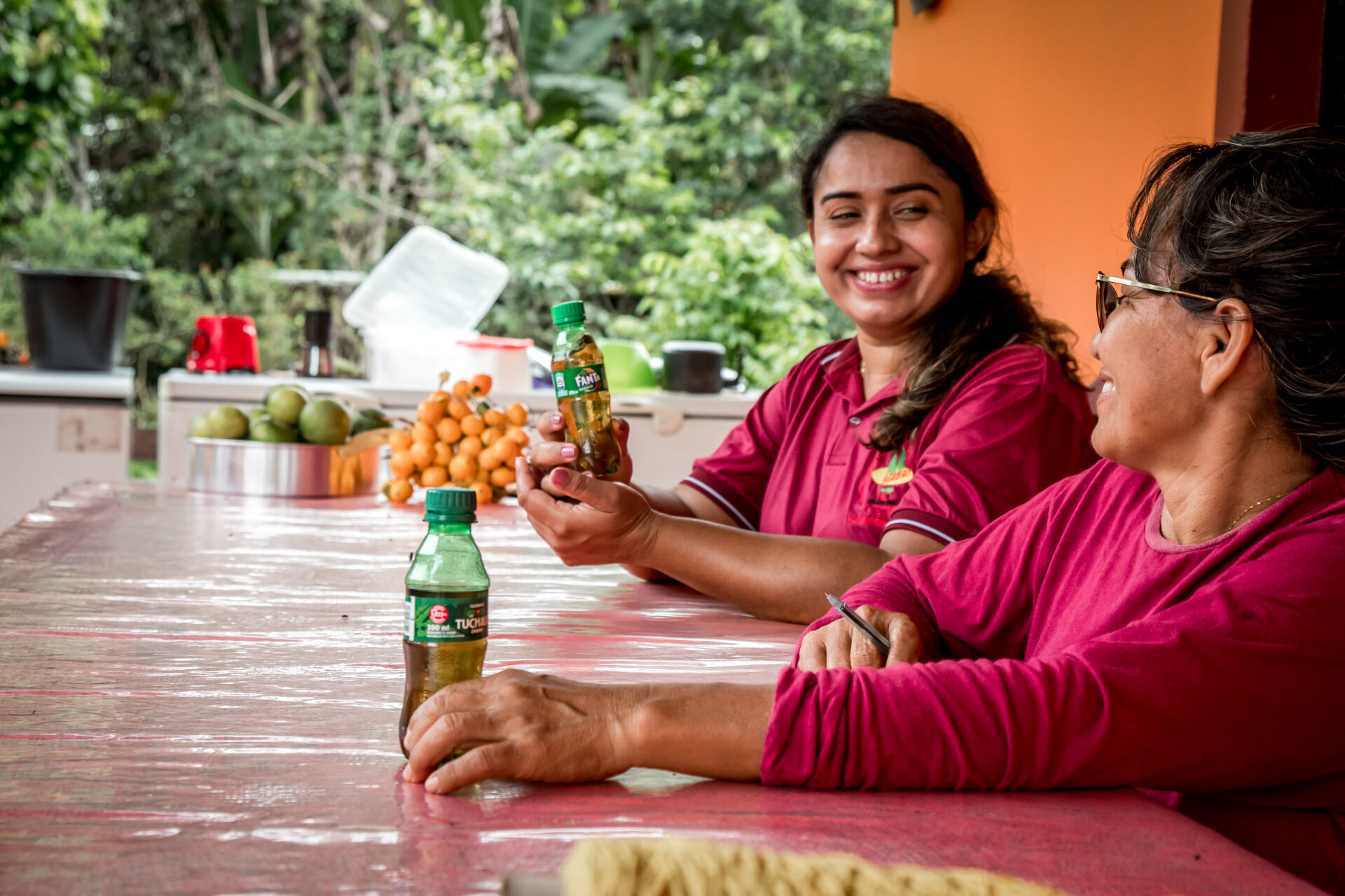 Two women drinking Fanta