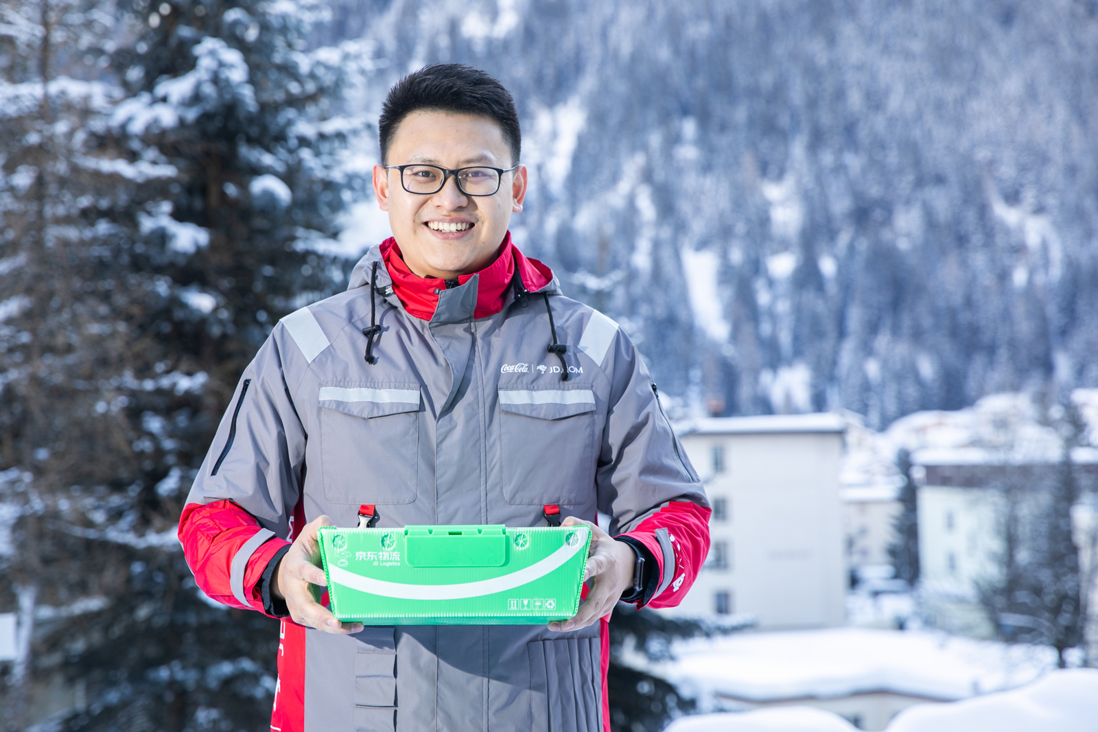 A JD.com staff wears a uniform made of recycled PET (rPET) materials co-created by Coca-Cola China and JD.com which demonstrates used PET bottles can be back to the value chain and be recycled into rPET products.