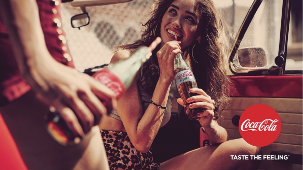 girl drinking cola in a can