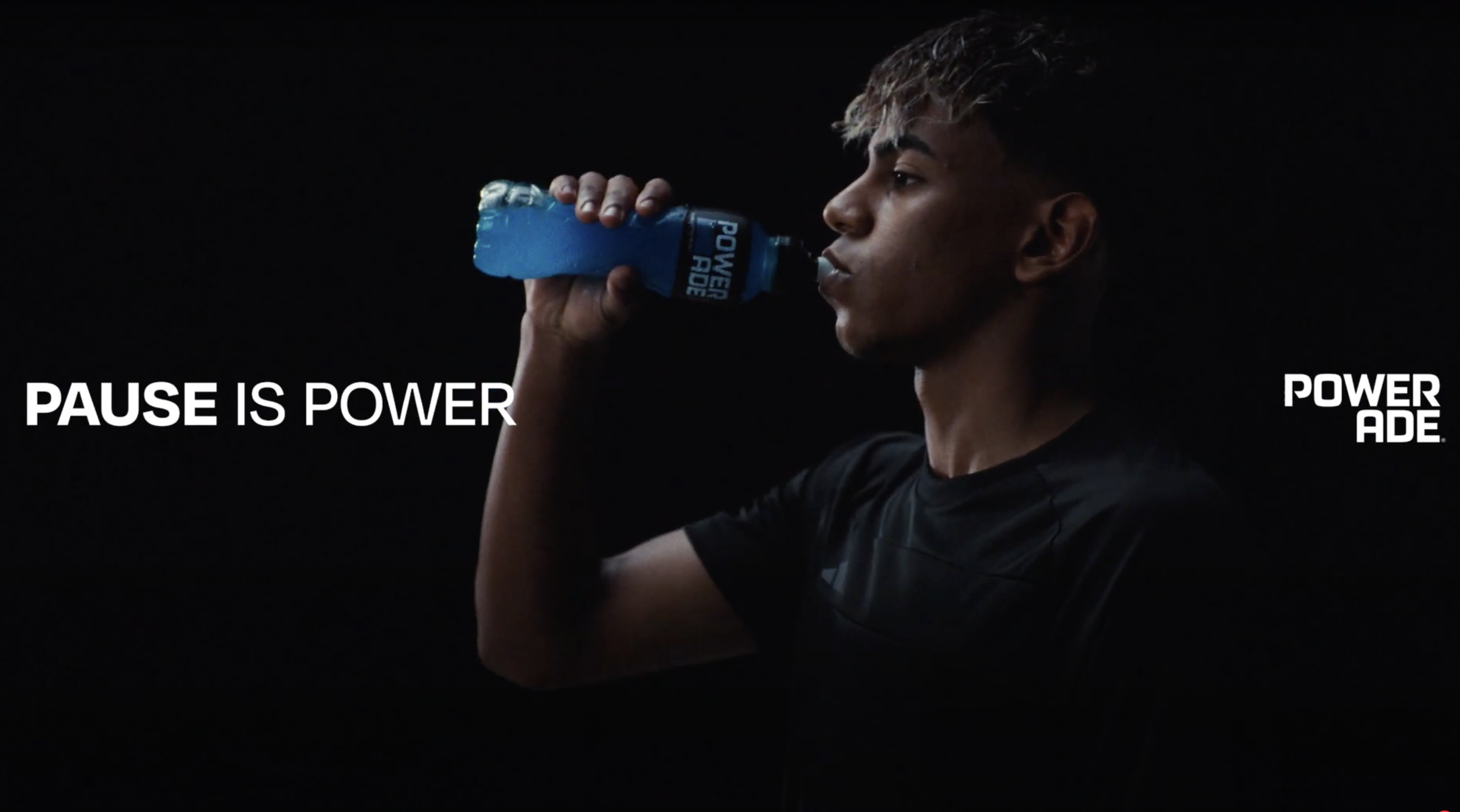 Athlete drinking a bottle of Powerade