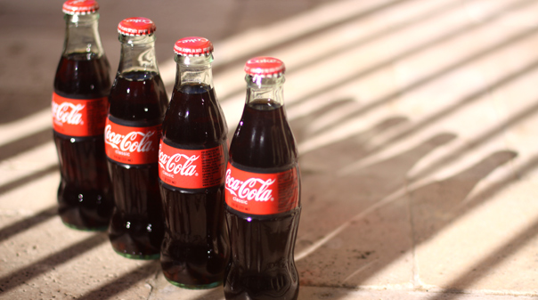 a row of coca-cola bottles