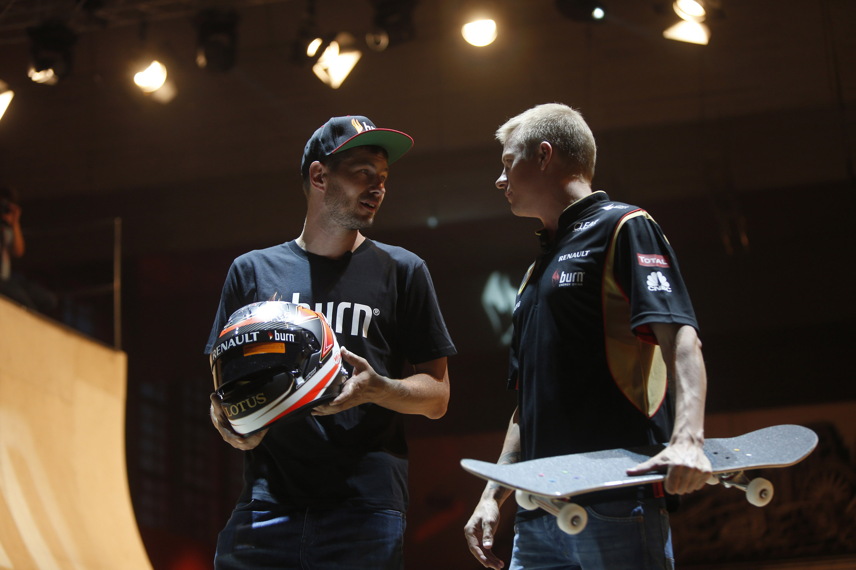 Lotus F1¨ Team driver Kimi R ikk nen, The Iceman, chatting to champion skateboarder Rune Glifberg on the worldÕs largest skate-able sculpture at burn Yard Live in Budapest, 26th July 2013