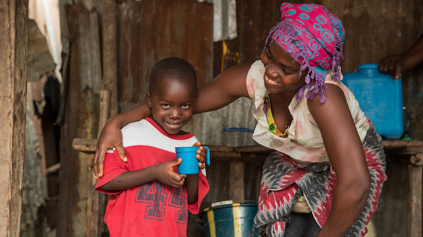 A woman and a child smiling