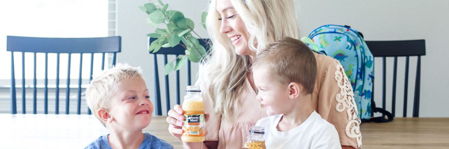 Mother and two sons drinking Minute Maid juice