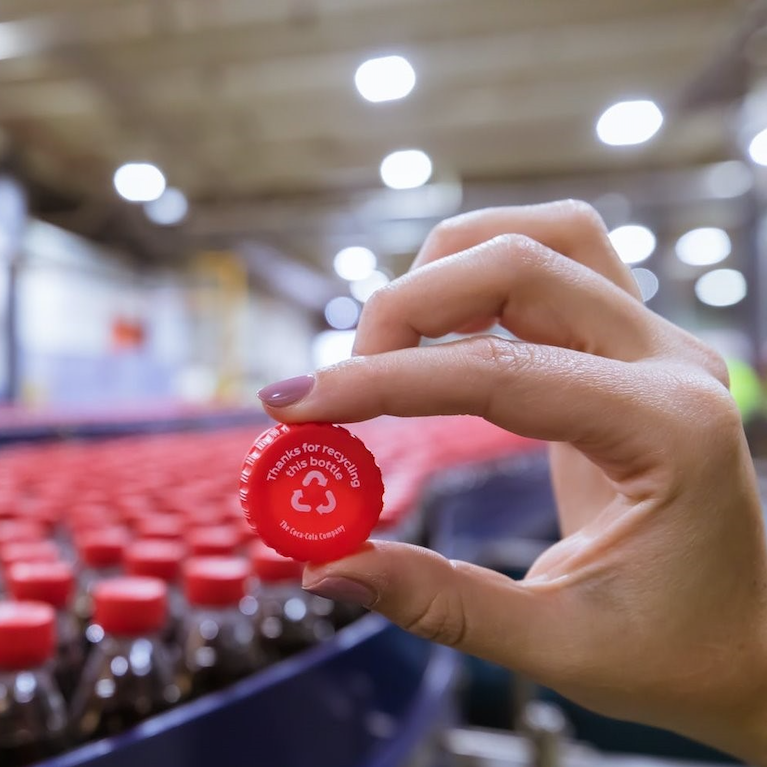 Coca-Cola bottle cap that reads "Thanks for recycling this bottle" ESG report