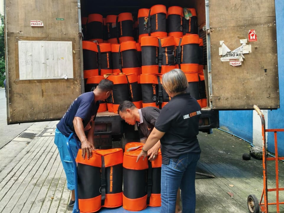 3 people loading a truck