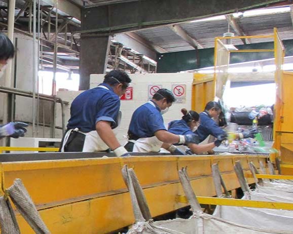 Workers on a recycling line