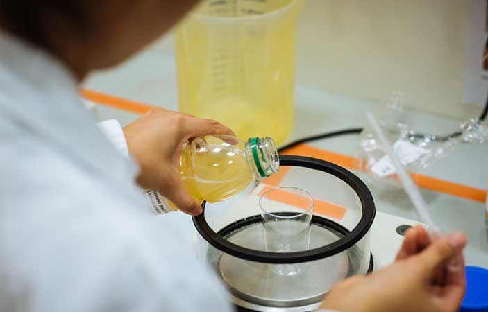 Orange juice test performed in Coca-Cola R&D laboratory.