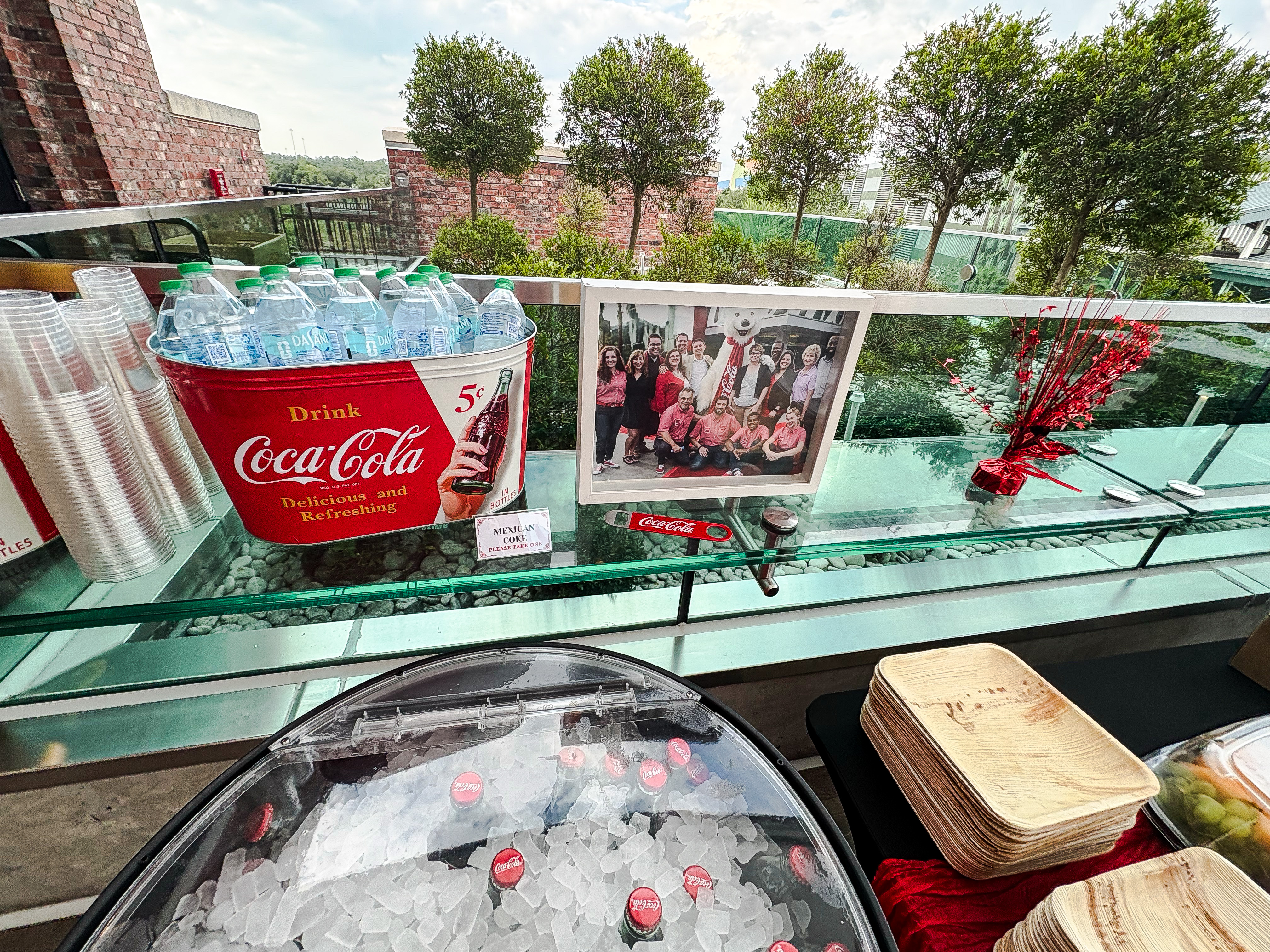 Rooftop 10-year Celebration decor with a framed photo of the original opening day team