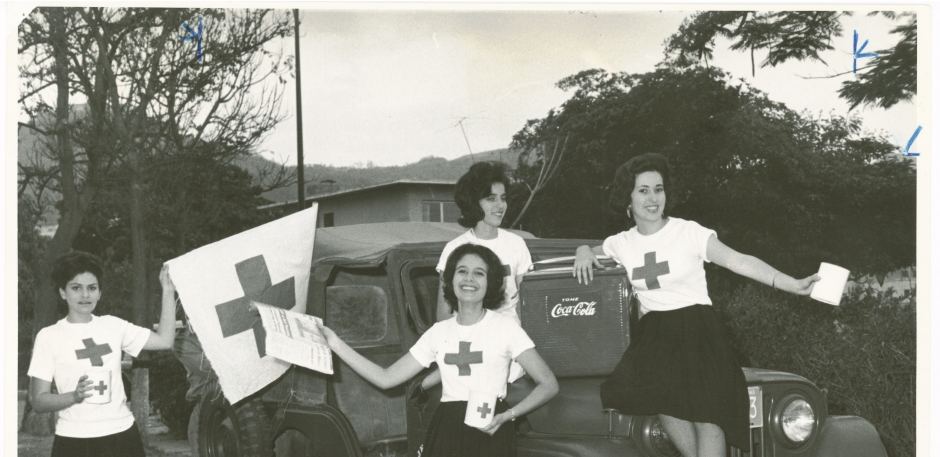 Coca-cola and the American Red Cross a Century Long Partnership. The Caracas Coca-Cola bottling plant teamed with prominent young women and the government to promote the Venezuelan Red Cross during its 1961 fundraising campaign.