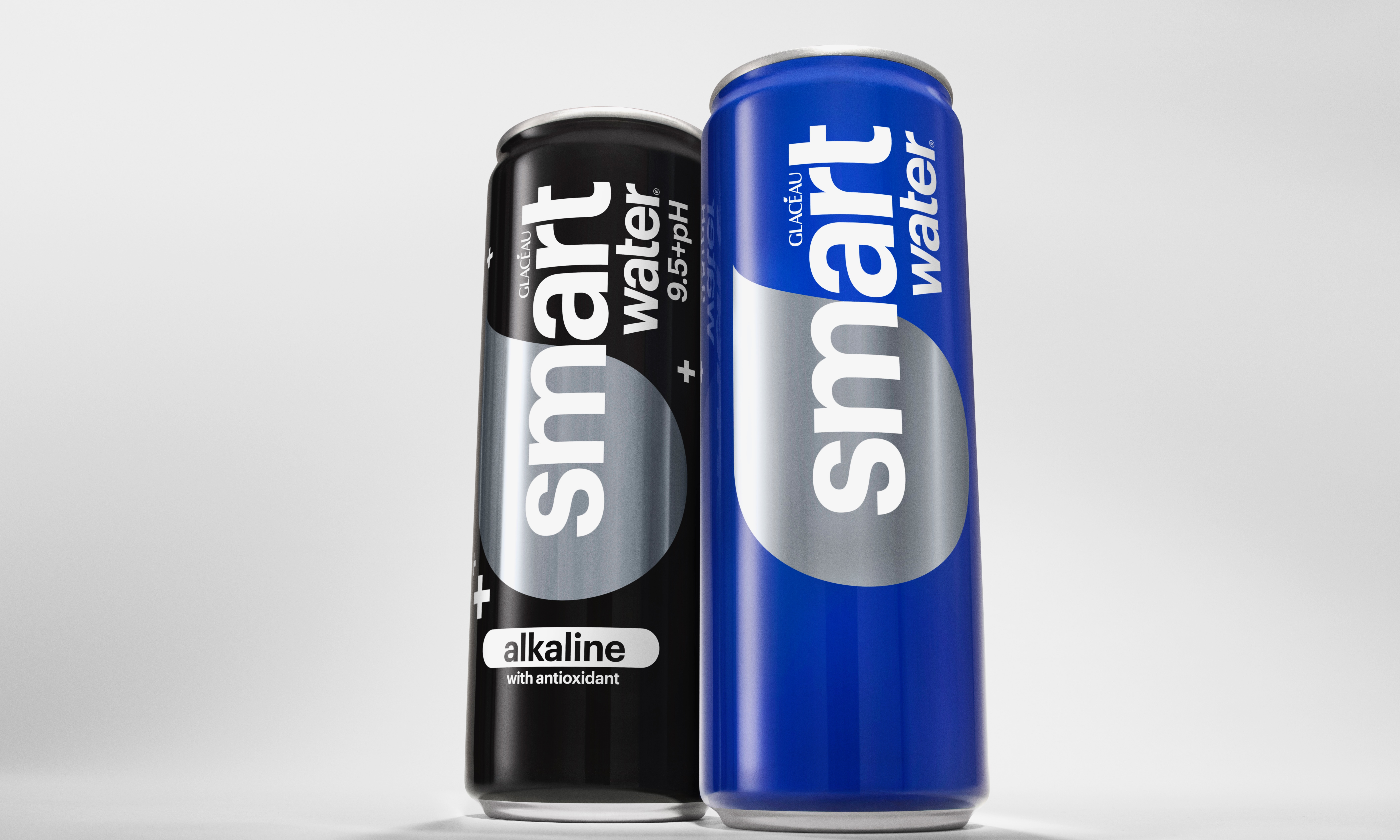 Two people holding cans of Coca-Cola Spiced