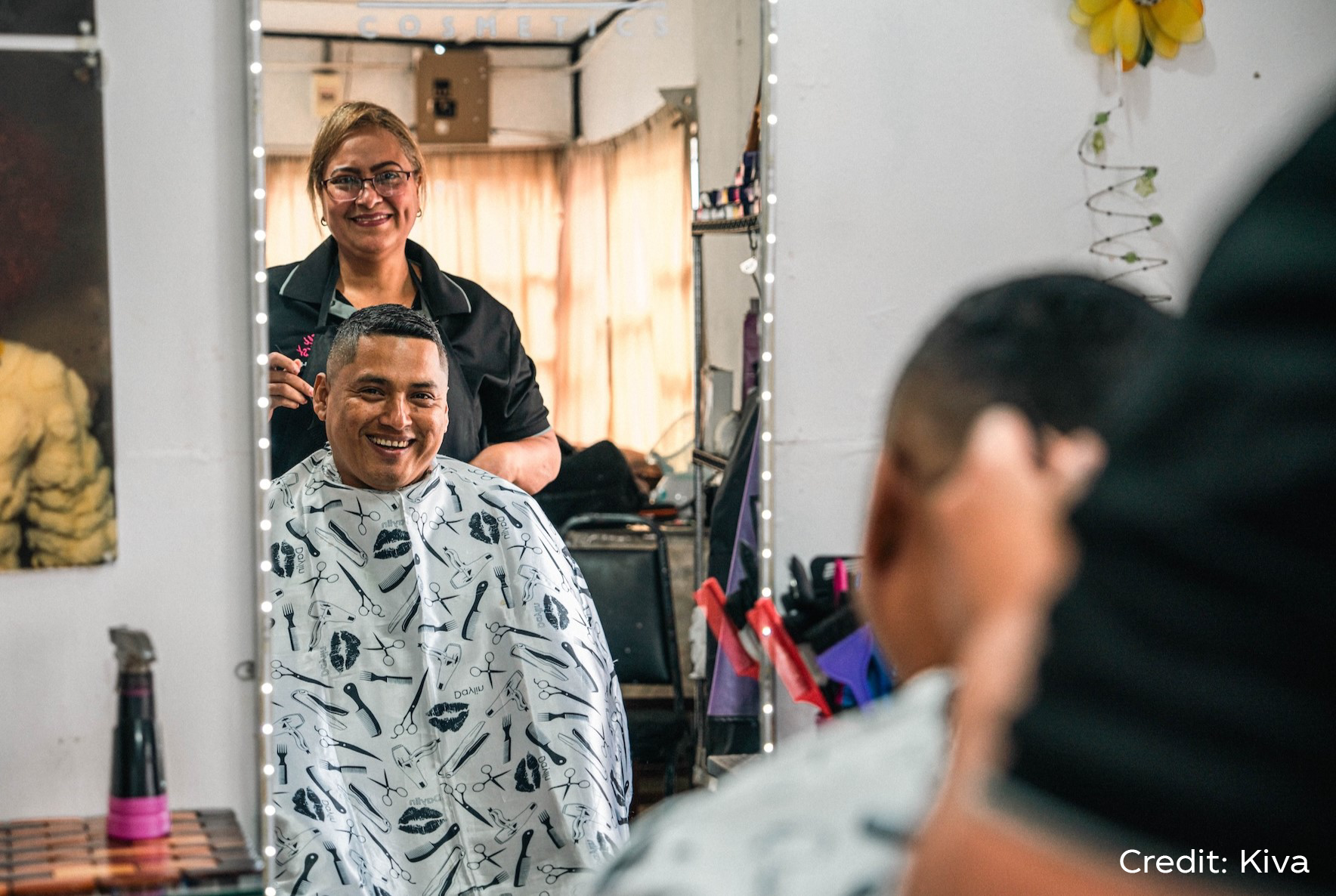 A woman doing someone's hair in a beauty salon