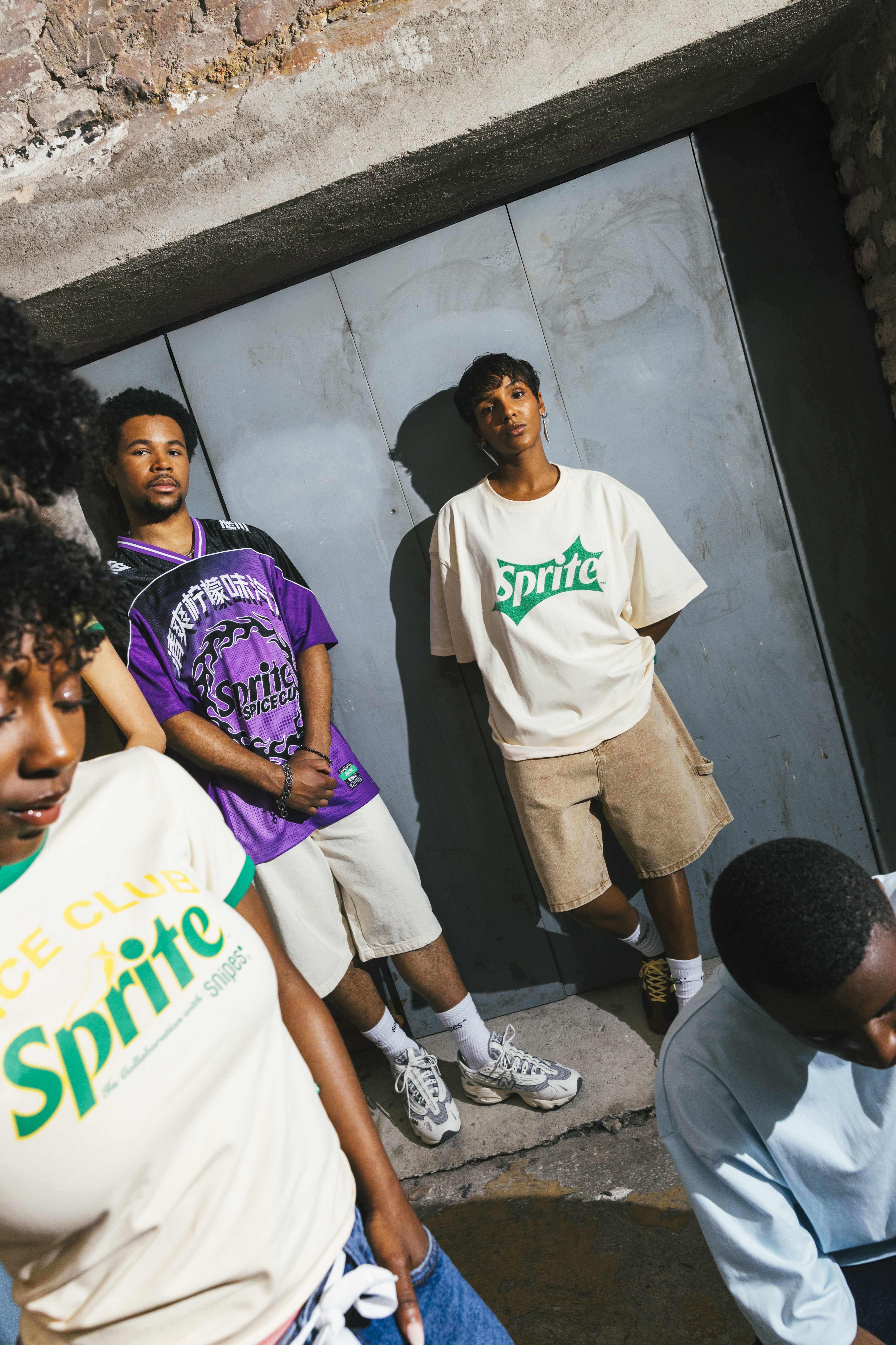 Young adults modeling the SNIPES x Sprite Collection