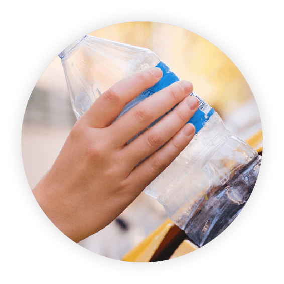 Hand holds nondescript plastic bottle