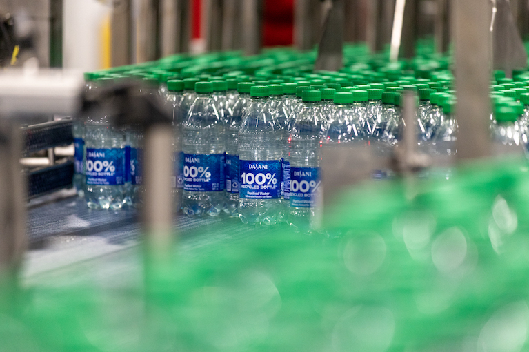 Recycled Dasani bottles on a conveyor belt